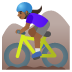 🚵🏾‍♀️ woman mountain biking: medium-dark skin tone display on Google